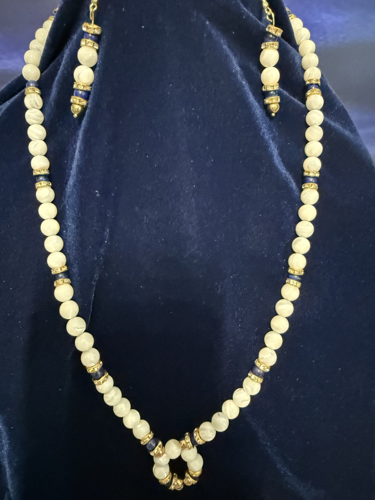 Handcrafted Mother of Pearl and royal blue cat's eye necklace and earring set on navy velvet — a Katt's Stuff Original Creation