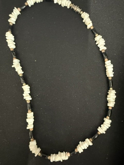 Full view of 15 inch shell chip and black tube bead necklace