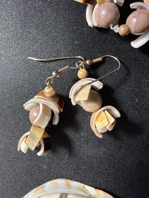 Detail of mixed shell beads including brown and cream tones
