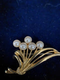 Vintage gold-tone faux pearl bouquet spray brooch front view showing five pearls on stems