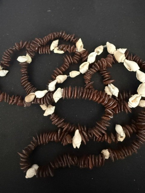 Full view of 36 inch kukui seed and shell continuous loop necklace