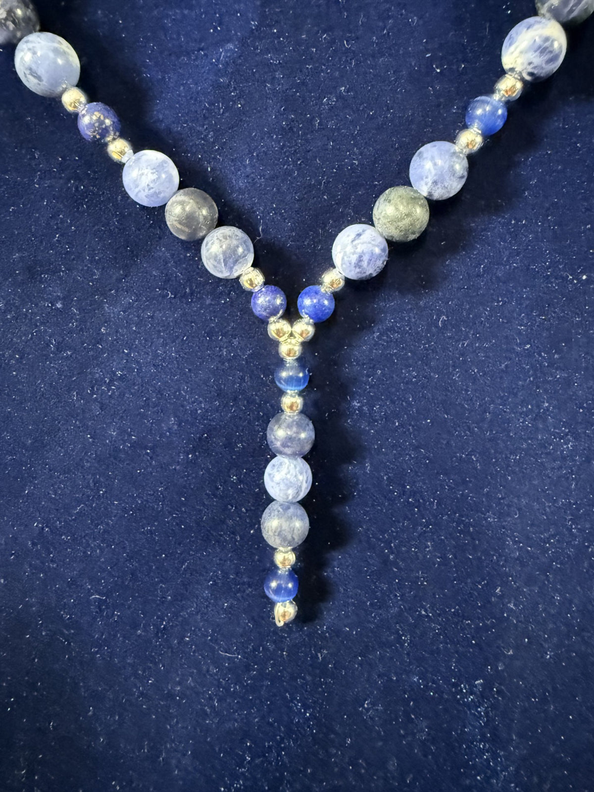 Close-up of the 2-inch beaded Y-drop with silver-plated accents