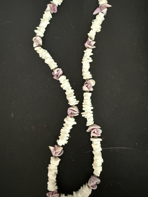Full view of white shell chip and mauve rose bud necklace