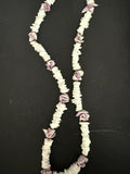 Full view of white shell chip and mauve rose bud necklace