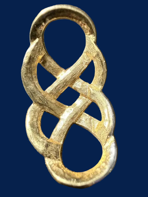 Vintage two-tone Celtic knot brooch — back view showing bar pin and patina