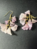 Blush pink cascading flower cluster dangle earrings in frosted glass or lucite on gold-tone chain links