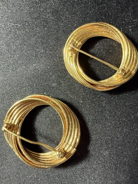 Vintage gold-tone circular swirl brooches — back view showing bar pin backs intact