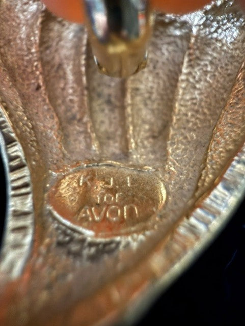 Close-up of K.J.L for AVON signature on clasp