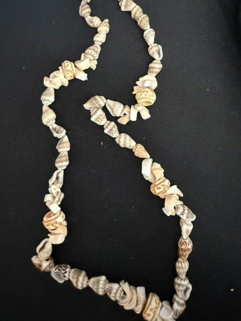 Full view of 20 inch mixed shell necklace with orange cone accents