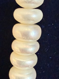 Full pearl strand on navy velvet bust
