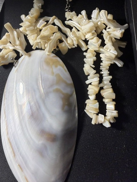 Large iridescent shell pendant necklace with graduated white branch coral chips, full view