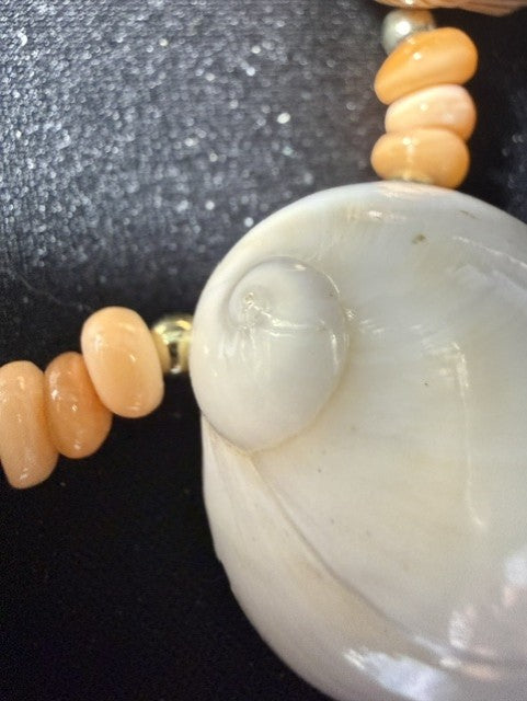 Smooth white moon shell on vintage whole shell necklace with peach coral rondelle spacers