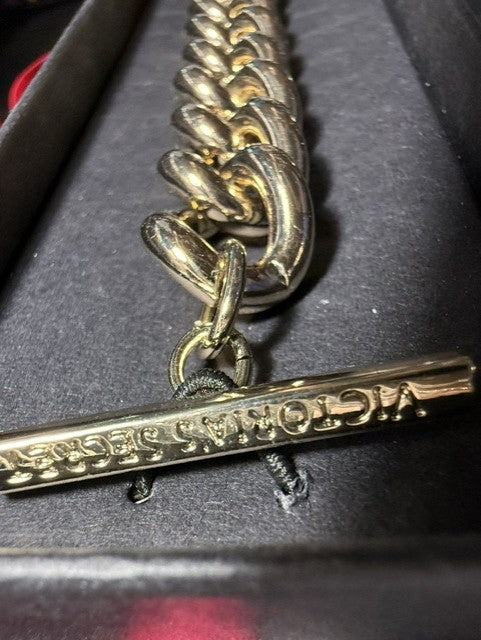 Victoria's Secret hang tag showing brand name on bracelet