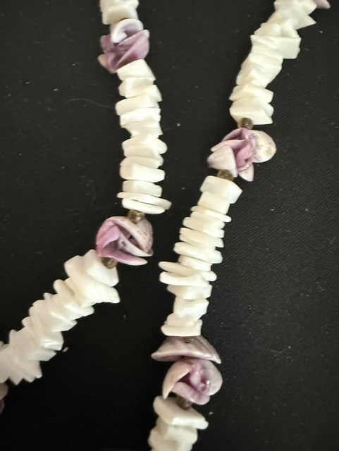 Detail view of shell chip and rose bud pattern