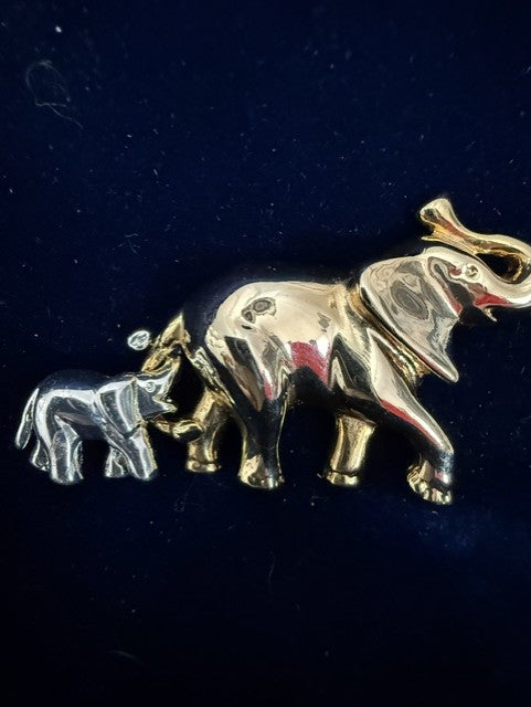 Vintage Liz Claiborne two-elephant brooch front view showing gold-tone and silver-tone elephants with trunks up