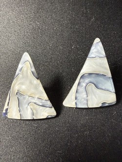 Pair of triangular natural shell stud earrings in grey and lavender, flat lay