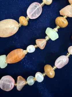 Vintage 3-strand gemstone necklace on navy velvet — full view showing carnelian, rose quartz, and pearl strands