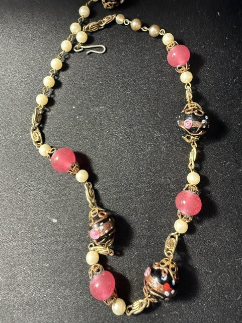 Close-up detail of Venetian wedding cake lampwork beads with filigree wire wrapping