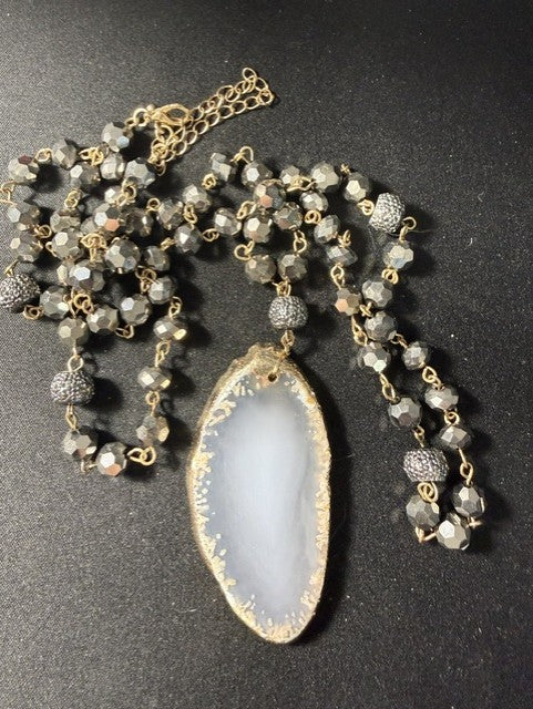 White druzy agate slice pendant necklace with gold-dipped edges and crystal bead chain