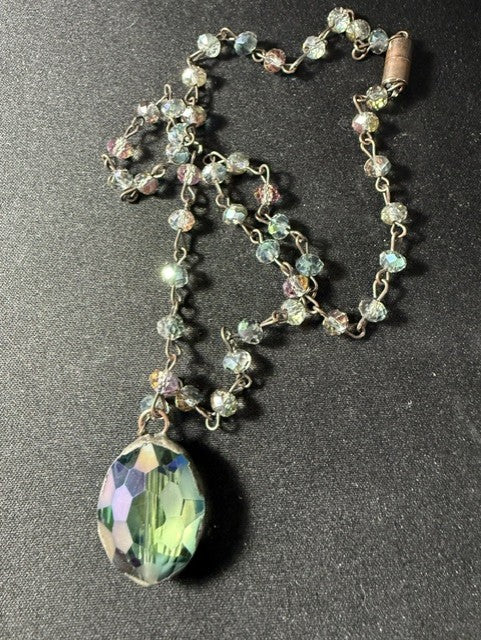 Full view of vintage aurora borealis crystal necklace with blue-green pendant