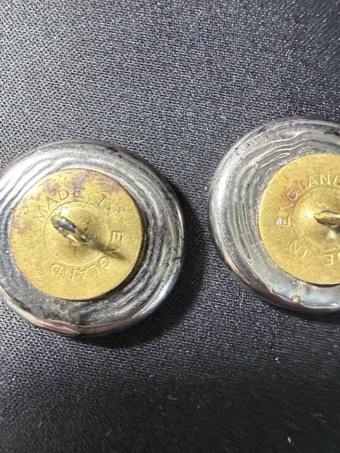 Back of antique English buttons showing brass shank and Made in England stamp