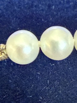 Close-up of hand-knotted cultured pearls showing nacre and luster