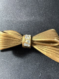 Vintage Gold-Tone Celluloid Bow Brooch with Rhinestones