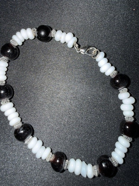 Black and white puka shell bead bracelet - lobster clasp detail