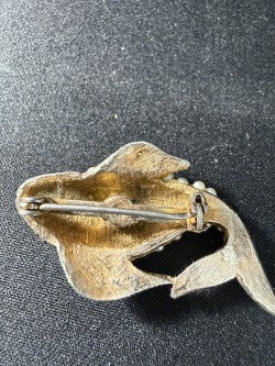 Back view of koi fish brooch showing pin stem and C-catch closure