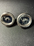 Pair of antique English camel intaglio buttons showing navy glass face with raised camel motif