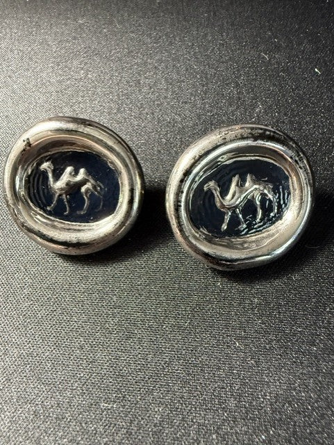Pair of antique English camel intaglio buttons showing navy glass face with raised camel motif