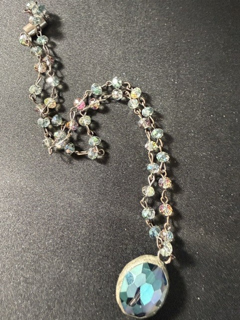 Detail of wire-wrapped crystal bead chain and barrel clasp