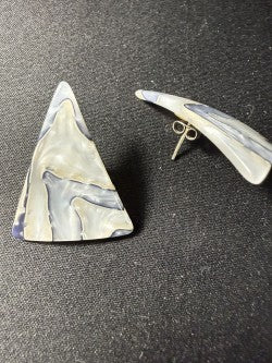 Side profile of triangular shell stud earring showing post back