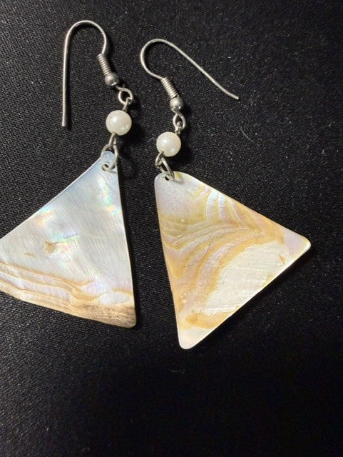 Side view of vintage shell triangle dangle earrings showing fish hook closure