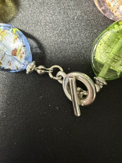 Multicolor pastel acrylic bracelet showing toggle clasp detail