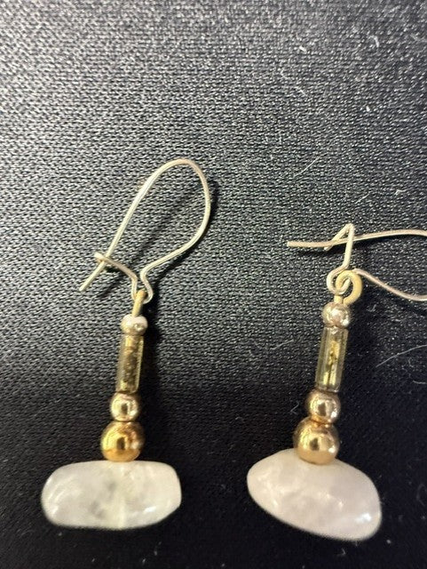 Front view of handmade rose quartz dangle earrings showing stone and gold bead detail