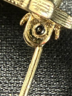Close-up detail of C-clasp pin mechanism, open and functional