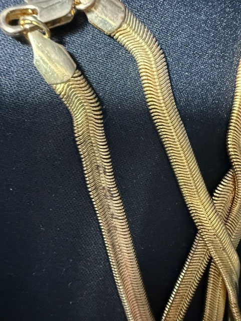 Close-up of herringbone chain weave and lobster clasp