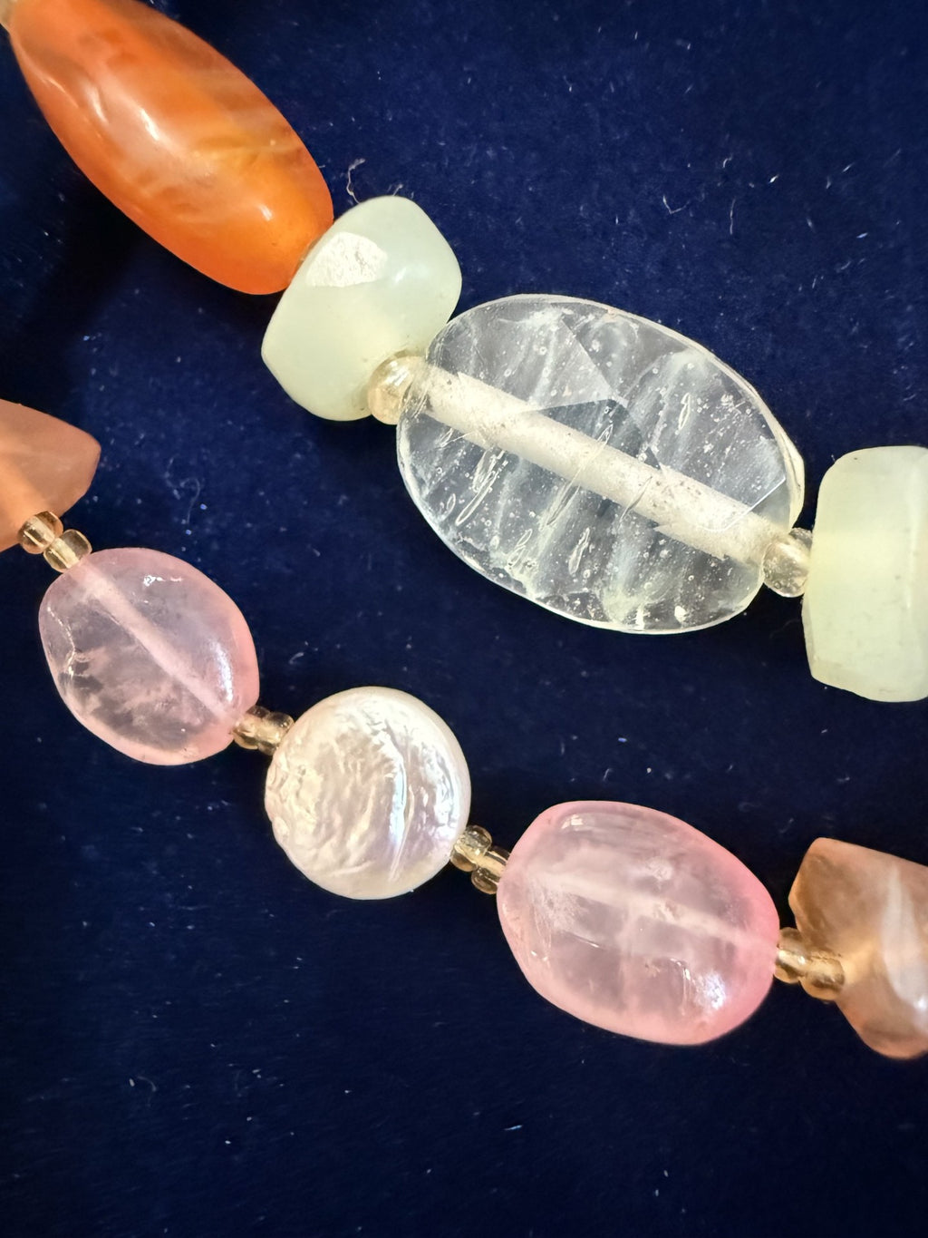 Macro detail — rock crystal quartz, aquamarine, rose quartz and freshwater pearl beads