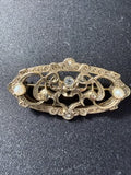 Edwardian gold-tone filigree brooch with seed pearls and rhinestones, front view