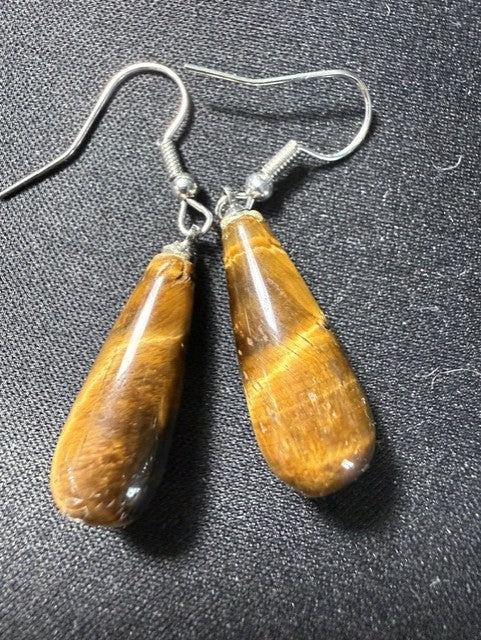 Pair of tiger eye teardrop dangle earrings showing rich amber and brown chatoyancy