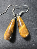 Pair of tiger eye teardrop dangle earrings showing rich amber and brown chatoyancy