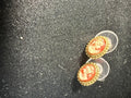 Vintage resin cameo stud earrings with beaded gold-tone bezel, coral ground, cream profile