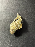 Front view of vintage gold-tone koi fish brooch with pearl cabochon scales