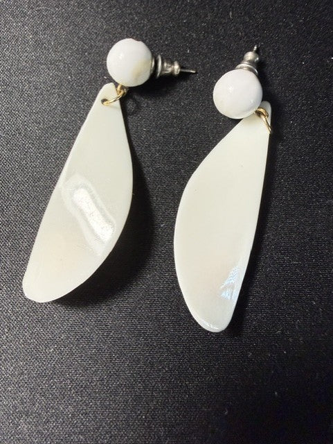 Back view of Avon white teardrop dangle earrings showing ball stud and post closure