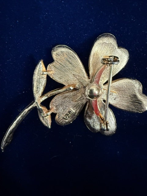 Vintage JJ gold-tone flower brooch back view showing JJ signature and pin clasp