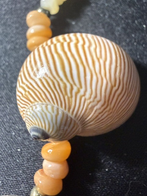 Vintage whole shell necklace — striped brown Sundial shell with peach rondelle spacers and gold accent beads