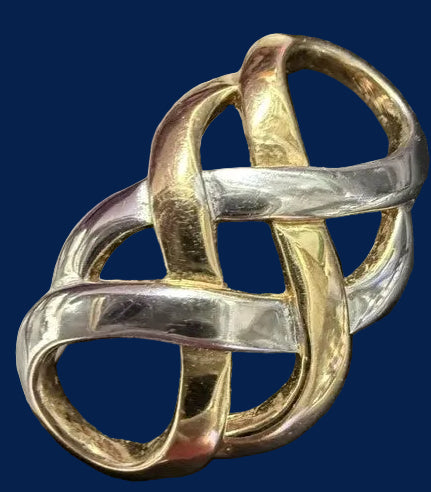 Vintage two-tone Celtic knot brooch with ruler showing approximately 1.5-2 inch size